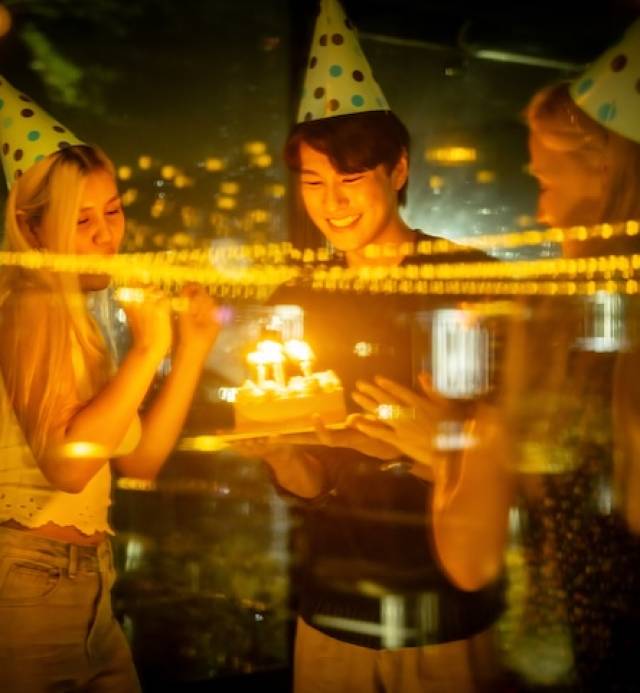 happy-birthday-party-with-friends-in-low-light-2025-01-31-05-17-27-utc